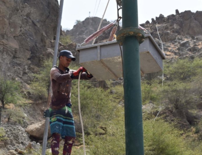 People of Lomba Tantum wait in despair for the fish transport cable car to be repaired